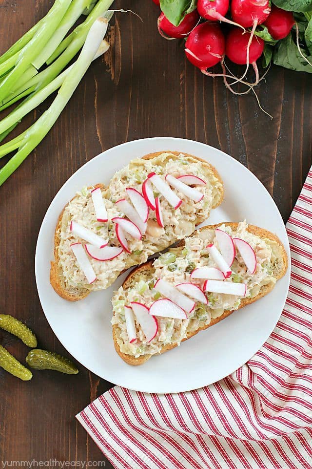 Take that boring tuna sandwich to the next level and make this Mediterranean Hummus Tuna Sandwich Recipe! It's easy, healthy and super flavorful! Definitely a lunchtime winner!