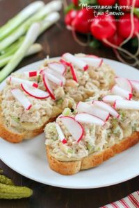 Take that boring tuna sandwich to the next level and make this Mediterranean Hummus Tuna Sandwich Recipe! It's easy, healthy and super flavorful! Definitely a lunchtime winner!