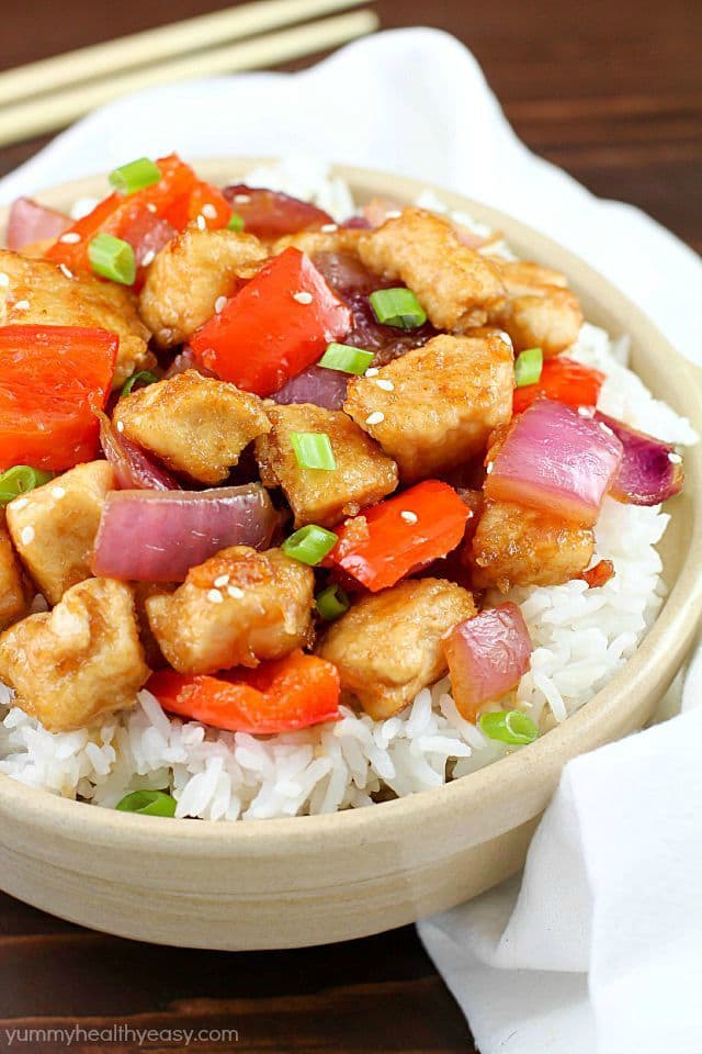 The most incredible Orange Chicken Stir Fry with pan seared chicken, red bell peppers, onion and a delicious sweet and savory sauce served over rice. So easy and so flavorful!
