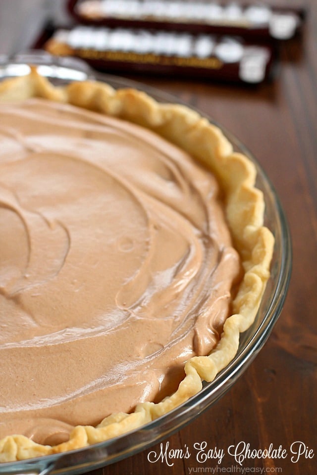 An incredibly Easy Chocolate Pie recipe that my Mom makes every Thanksgiving as a tradition. This is so simple and uses no pudding. This is a family favorite chocolate pie! A must for your holiday dessert table!