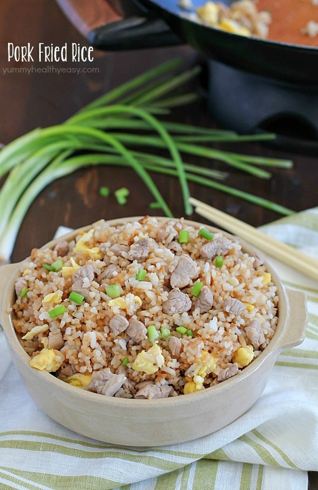 Crazy delicious kid-friendly, family-favorite Pork Fried Rice that's easy, only has seven simple ingredients, takes 20 minutes or less and will WOW any and everyone! Definitely PIN this for later!