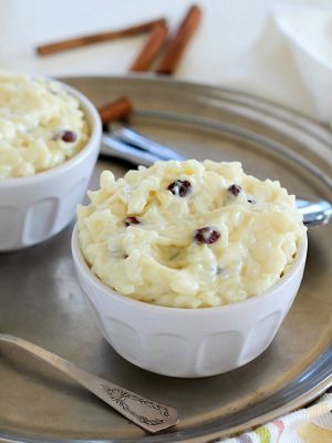 This delicious and creamy Eggnog Rice Pudding recipe will have you ready for the holidays! The textures in this rice pudding will wow your tastebuds. The rice is tender, the raisins are chewy and the pudding part is so creamy. Add in eggnog flavor and it's like heaven in your mouth. #AD