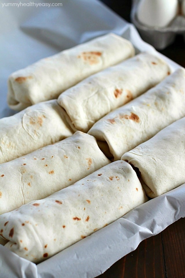Freezer Breakfast Burritos are the best breakfast for busy people! Fix up a batch (so easy!) and throw in the freezer. When you're rushed to get out the door in the morning, throw a freezer breakfast burrito in the microwave and you're out the door with a healthy breakfast in minutes! 