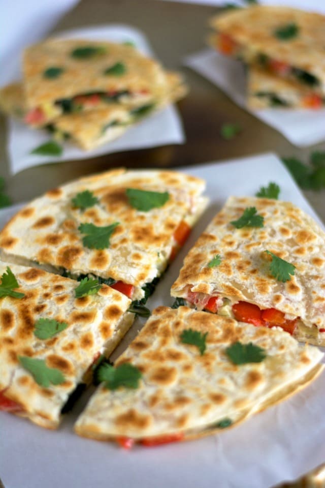These Smoked Gouda & Turkey Artichoke Quesadillas come together quickly using leftover turkey, two types of cheese, red peppers and artichokes! They are a delicious and easy appetizer or light dinner!