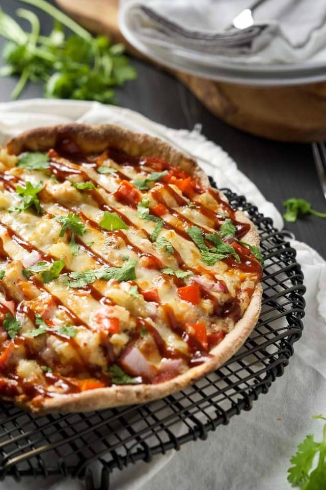 Chipotle BBQ Chicken Cast Iron Skillet Pizza is our new favorite way to make pizza! Sweet and spicy BBQ Chicken pizza has a crispy crust thanks to the cast iron skillet!