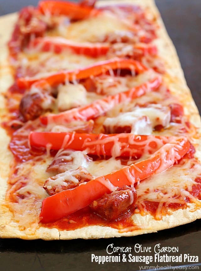 Copycat Olive Garden Pepperoni & Sausage Flatbread Pizza is such a quick and easy dinner! Flatbread is layered with marinara sauce, roasted red peppers, pepperoni, sausage & cheese then baked. Easy and delicious! AD