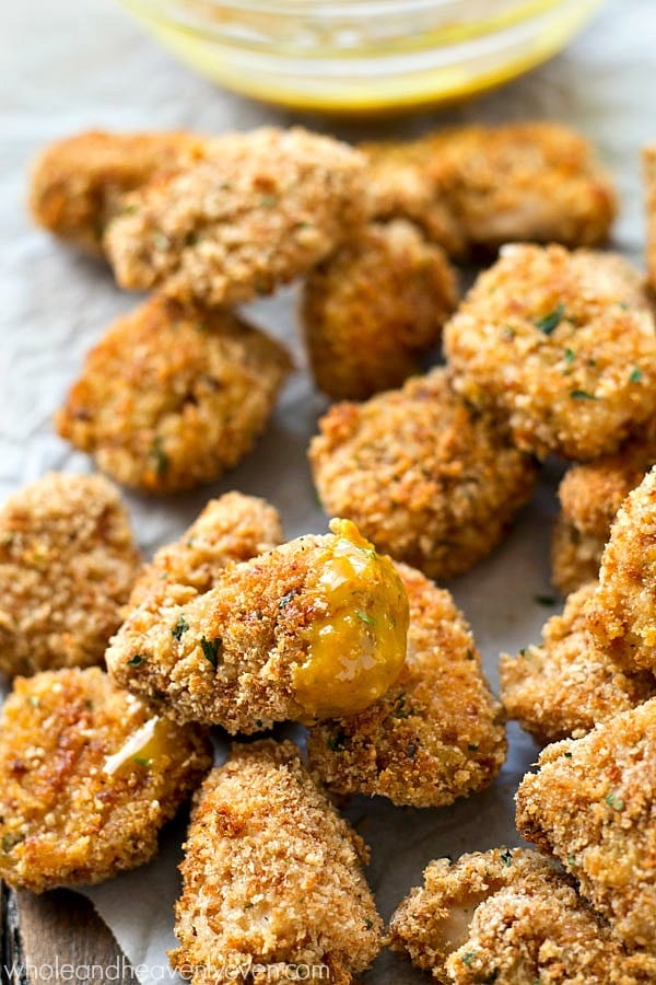 These addicting chicken nuggets are SO extra-crispy on the outside, you won’t believe that they’re oven-baked! Dip ’em in a tangy honey mustard dip for the best dinner ever!