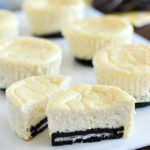 Mini Cheesecakes with an Oreo crust! This lighter recipe is absolutely delicious and super easy to make. Only a few ingredients & whipped up in a matter of minutes. With less calories than a regular cheesecake + built-in portion control with the muffin tin! These are a dessert worthy of guests or just for fun.