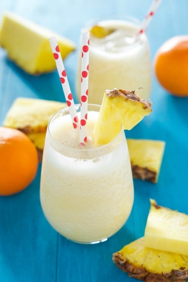 This Pineapple Orange Creamsicle Smoothie is a creamy, 5 ingredient smoothie tastes like a tropical cocktail and an orange julius! A protein and vitamin C packed treat to start your day or get you through a long afternoon!