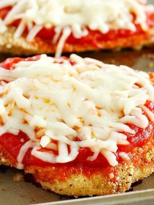 Time to change up that fattening Chicken Parmesan Recipe and make it skinny!! This lightened up comfort food dish is super easy to make and made healthier by baking instead of frying among other things. You need to add this Skinny Chicken Parmesan to your weekly dinner rotation!