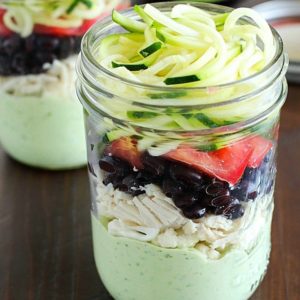 Avocado dressing (southwest style!) is nestled on the bottom of this delicious mason jar salad with zucchini noodles on the top and chicken, veggies and black beans tucked in the middle. A delicious and healthy low-carb, low-sugar lunch prepared ahead of time and eaten on-the-go! Plus a HUGE Blendtec Giveaway you won't want to miss!!