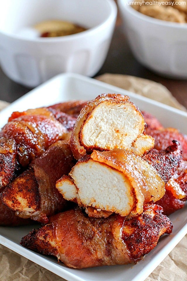 Brown Sugar Bacon Wrapped Chicken is one of my favorite dinners! Making this again tonight! You roll the chicken in spices and then wrap in bacon. Then roll in brown sugar and bake. SO easy, tender, juicy & flavorful. My family loves this chicken dinner! AD