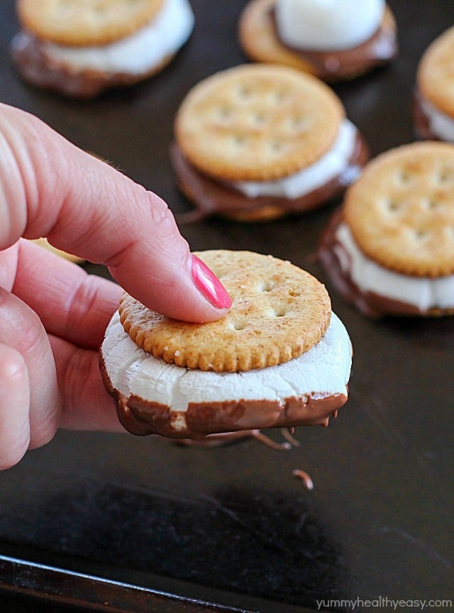 Oven S'mores Sandwiches for the WIN! You don't need a campfire to enjoy s'mores, make them in the oven instead! These oven smores are incredibly easy to make (about 5 minutes total!) and are the perfect combo of salty and sweet. So delicious! AD