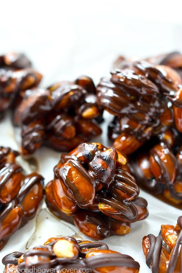 Roasted almonds, dark chocolate, and homemade caramel come together in these dark chocolate caramel almond clusters that whip up in minutes for whenever that sweet tooth craving hits!