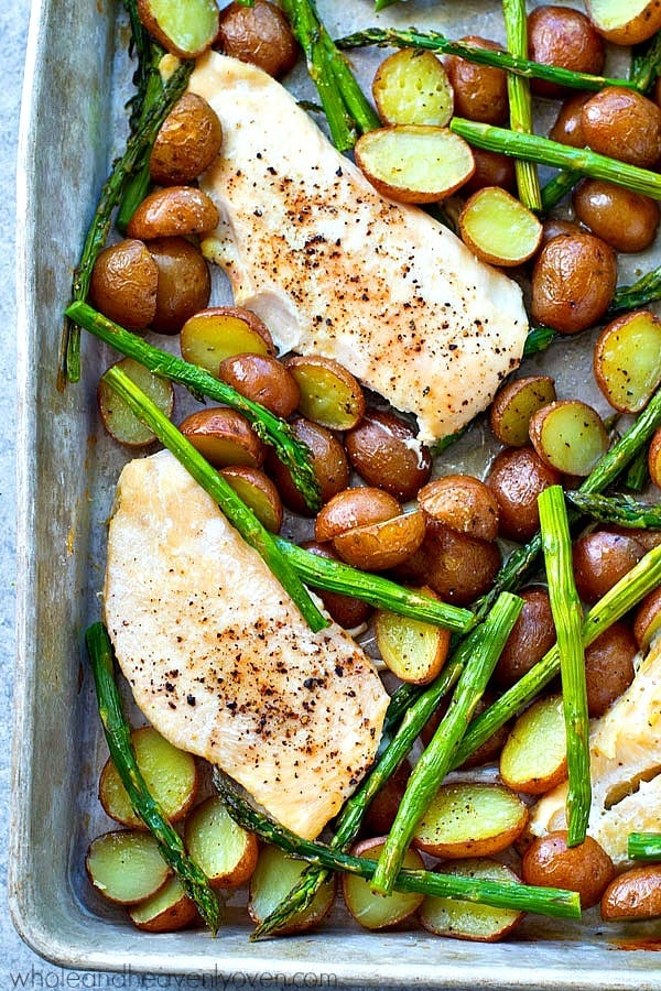 An entire dinner made in one pan! Juicy roasted chicken, tender asparagus, and lots of roasty fingerling potatoes for one winner of a dinner.