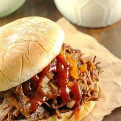 Slow Cooker Shredded Beef Sandwiches are one of my family's favorite make-ahead dinners! Cooked right in the crock pot with an easy & flavorful sauce, makes this beef roast tender and perfect for filling sandwiches/buns! Great to serve for dinner or for a party!