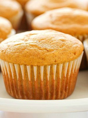 Easy Pumpkin Muffins are the perfect fall breakfast or snack! Using Bisquick as a shortcut makes these just about the easiest pumpkin muffins ever! Only 7 ingredients and 120 calories, you and your family will LOVE these delicious, light & fluffy easy pumpkin muffins for a quick fall breakfast!