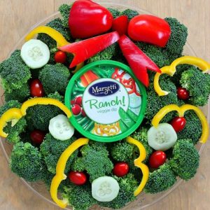 Turn your boring veggie tray into something cute for the holidays with this Christmas Wreath Holiday Veggie Tray! It's simple to make but will leave a lasting impression on your guests at any holiday party! AD