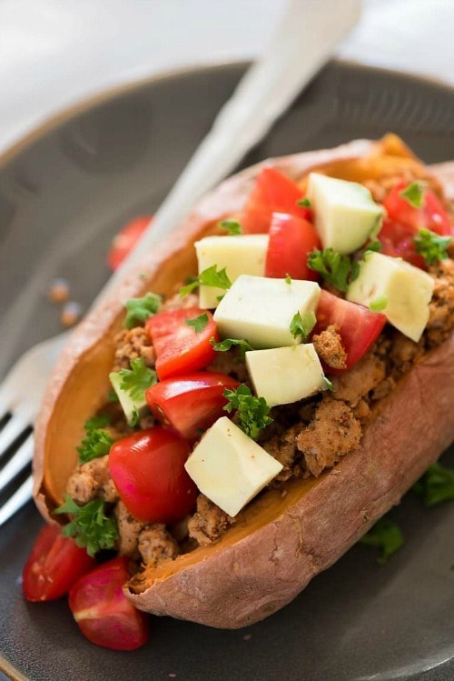 Taco Paleo Stuffed Sweet Potatoes require only 5 ingredients making these sweet and slightly spicy potatoes a healthy, make ahead dinner and lunch option!