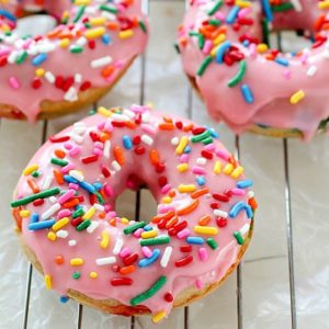 Baked Funfetti Donuts aka Birthday Donuts! These homemade donuts are made with healthier ingredients and baked. Topped with an easy glaze and funfetti sprinkles! Every bite has funfetti sprinkles!