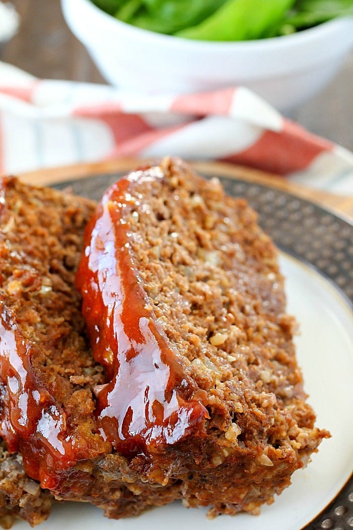 This Meatloaf Recipe is my family's FAVORITE Sunday night dinner! It really is the Best Ever Meatloaf, and it is incredibly easy to make. So much flavor packed inside with a delicious glaze spread on the top! 