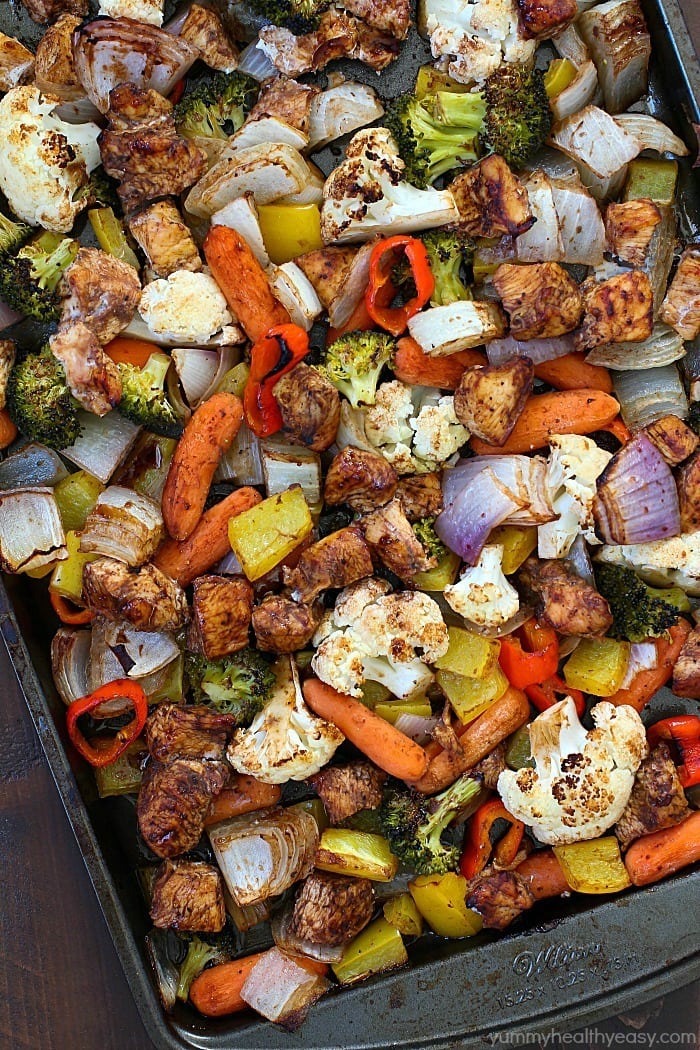 Sheet Pan Spicy Balsamic Roasted Chicken & Veggies for the WIN!! This dinner is full of fiber-filled veggies and lean chicken, tossed in a spicy balsamic sauce and then baked on a sheet pan. Easy peasy and gluten free, paleo and clean eating!