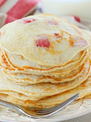 Start your day right with a stack of Strawberry Pancakes! They're a quick and easy to make breakfast the whole family will love!