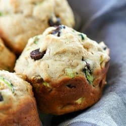 These Chocolate Chip Zucchini Muffins are the best of both worlds - healthy AND decadent! They're full of tender zucchini and chocolate chips but are made healthier by using applesauce instead of lots of butter. These make a yummy breakfast or after school snack!