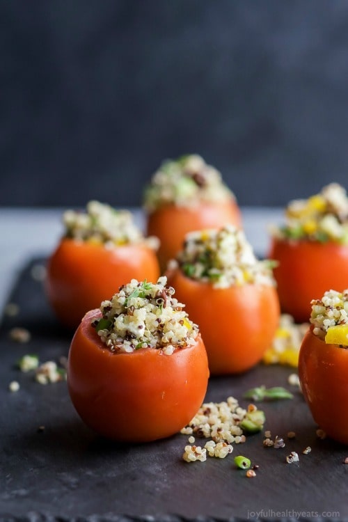 Mediterranean Quinoa Stuffed Tomatoes – an easy, light, and refreshing vegetarian recipe that’s only 142 calories! The perfect side dish for your next summer party!