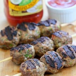 These flavorful Italian Meatballs are skewered onto sticks and grilled. This versatile dinner can be dipped in pasta sauce for a delicious low carb dinner, served on rolls for meatball sandwiches or over spaghetti! AD
