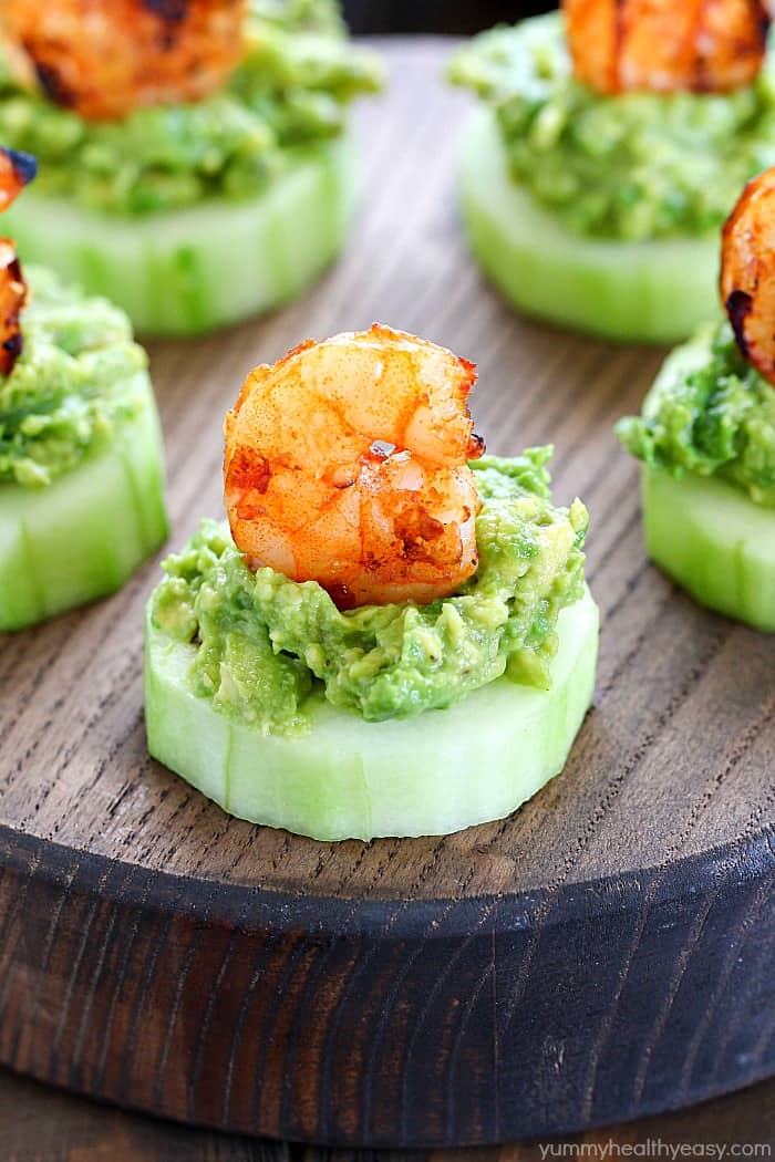 Need a quick & easy shareable appetizer? Make this Low Carb Avocado Shrimp Cucumber Appetizer! Little finger foods with cucumber, mashed avocado and topped with grilled spicy shrimp!