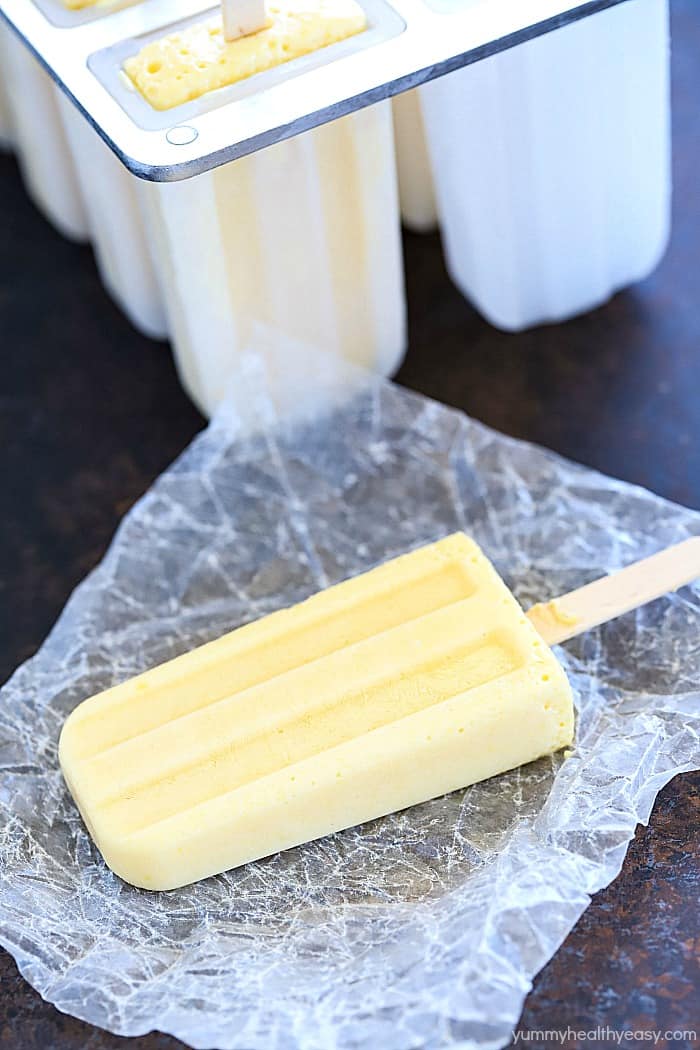 Everyone loves a popsicle! Try making your own at home with this Tropical Protein Popsicles Recipe! Only a couple of ingredients needed for a healthy, protein rich popsicle! #AD