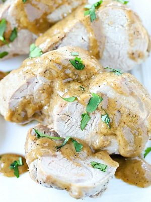 Get ready to WOW your family or guests with this incredibly tender and juicy baked pork tenderloin recipe with marinade sauce! #AD