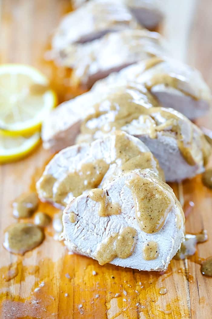 The juiciest and most flavorful baked pork tenderloin you will ever have! Slice it up and serve with the marinade sauce for a crazy yummy dinner! #AD