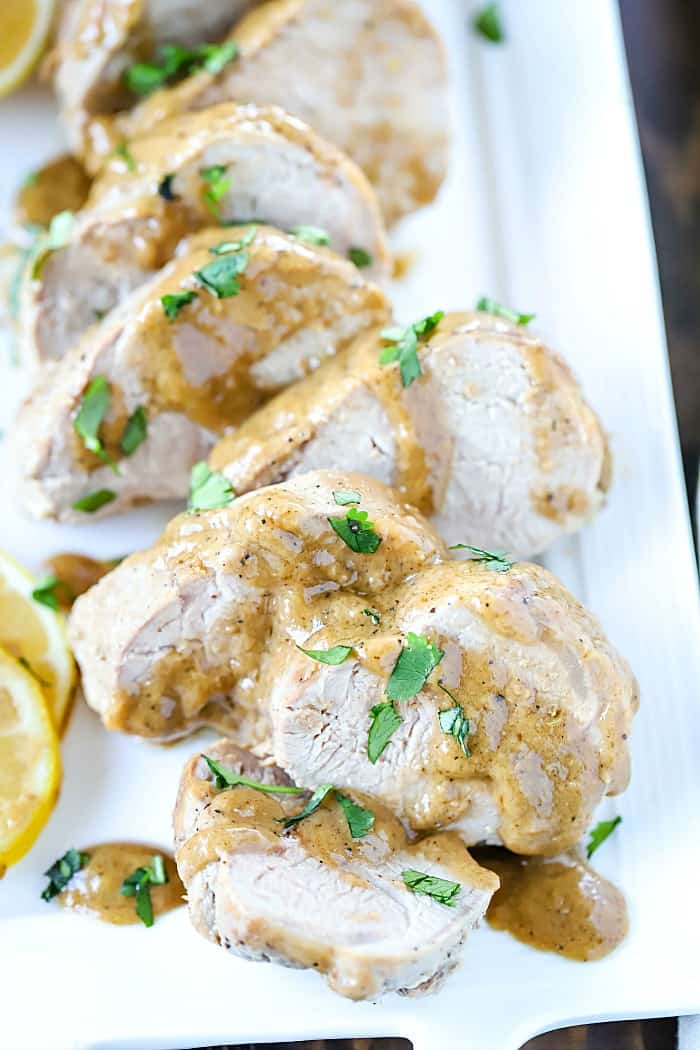 Tender and juicy marinated then baked pork tenderloin is an easy dinner recipe the whole family will love! #AD