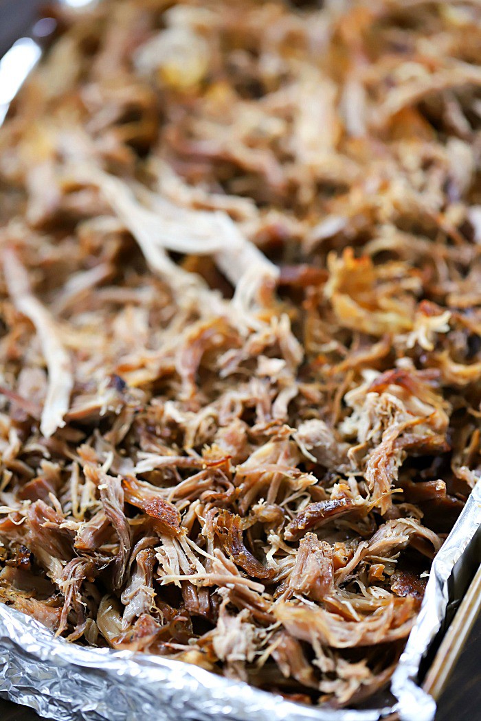 Pork butt is slowly roasted in the oven to make tender pulled pork for this Best Ever Pulled Pork Sandwich Recipe!