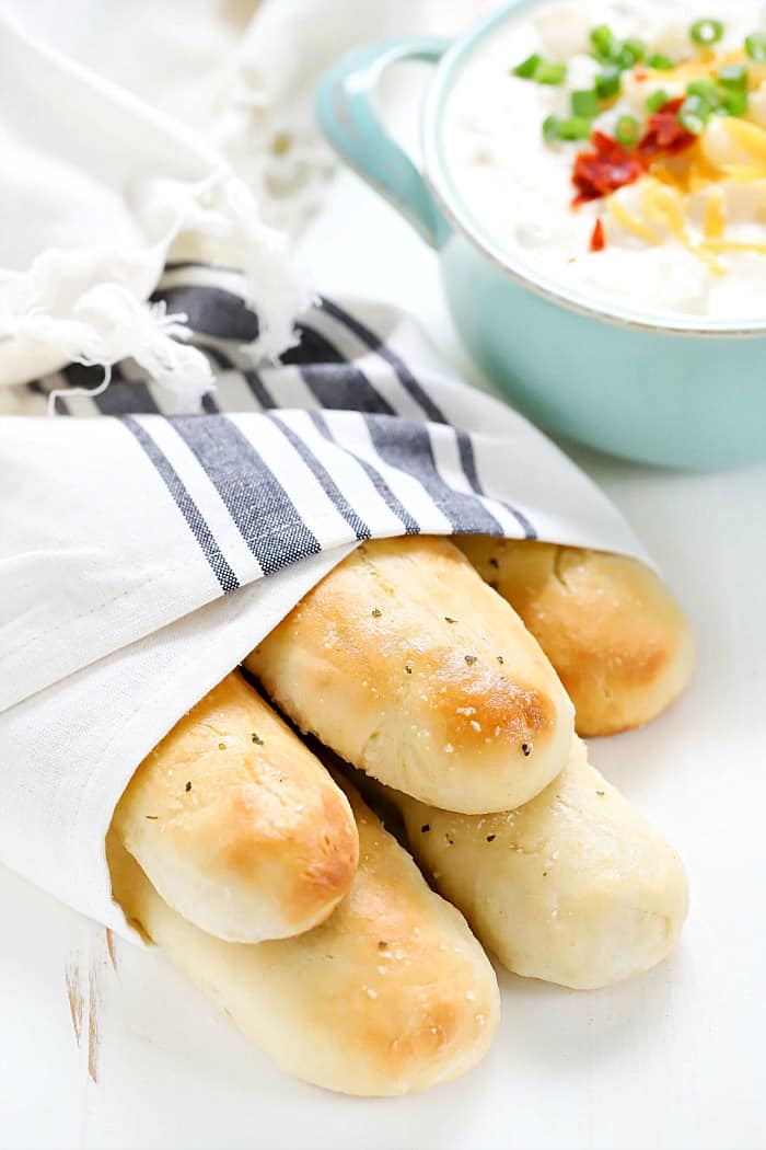 These Easy Homemade Breadsticks are SO good! Serve as a yummy side dish with any meal!