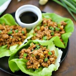 This Chicken Lettuce Wraps Recipe is seriously SO GOOD!! So much flavor in the asian inspired chicken mixture inside soft butter lettuce. Delicious!