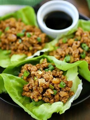 This Chicken Lettuce Wraps Recipe is seriously SO yummy! The chicken filling has delicious Asian inspired flavors with a little added crunch from the water chestnuts. This low carb recipe is great for an appetizer or a main dish.