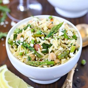 Beautiful Spring Orzo Salad filled with orzo, asparagus, toasted almonds, arugula, feta cheese and peas with a vinaigrette.