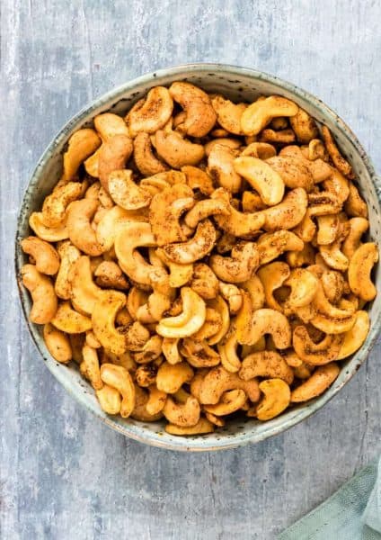 Top view of a gorgeous bowl of Spicy Roasted Cashew Nuts + 43 Healthy Snack Ideas