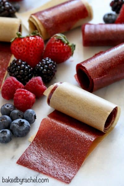 Rolls of Very Berry Fruit Leather and fresh berries + 43 Healthy Snack Ideas