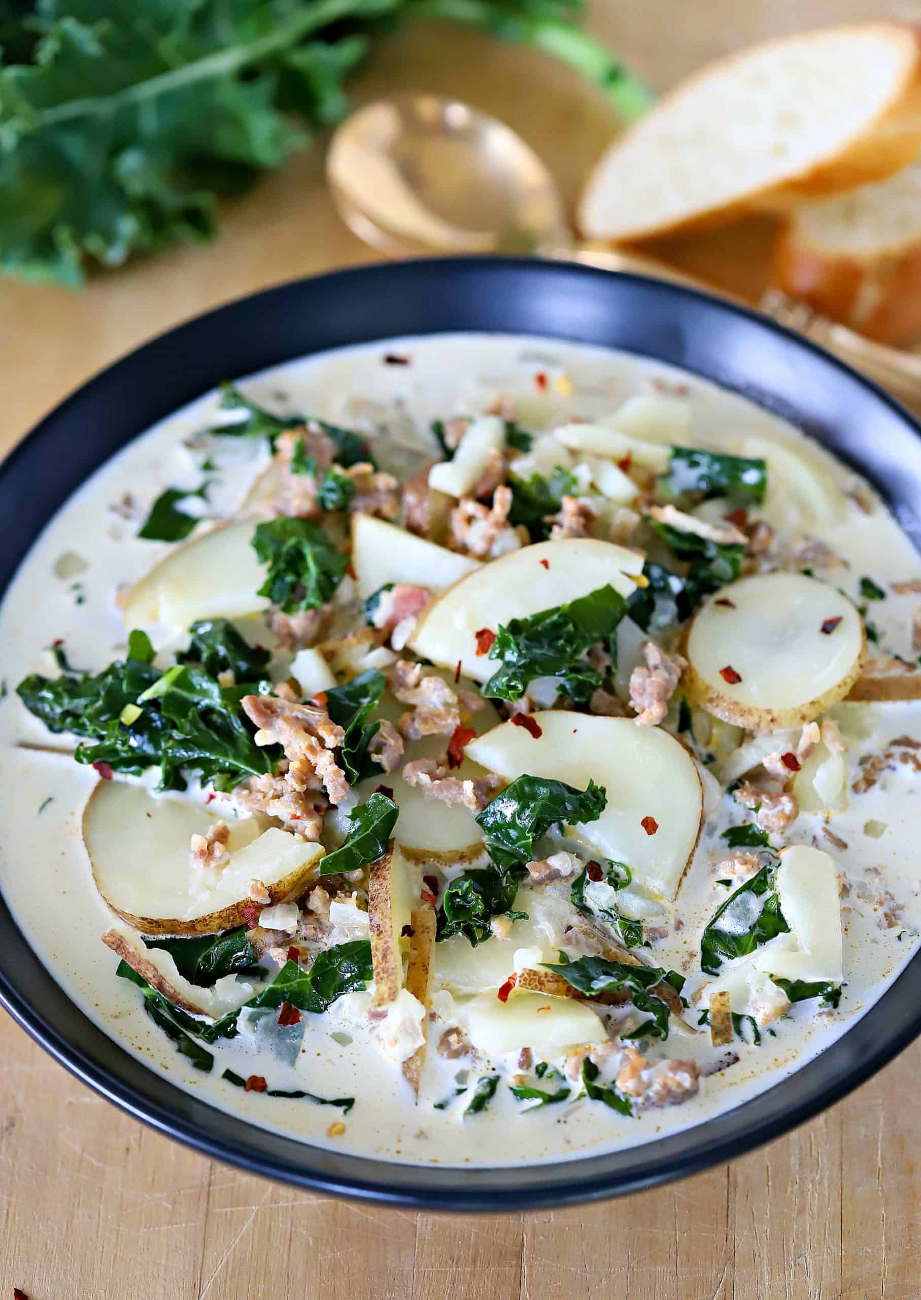 Bowl filled with Zuppa Toscana Soup.