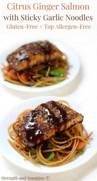 Two plates of Citrus Ginger Salmon on top of Sticky Noodles.