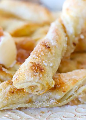 Apple Strudel Twists with a side of vanilla cream.